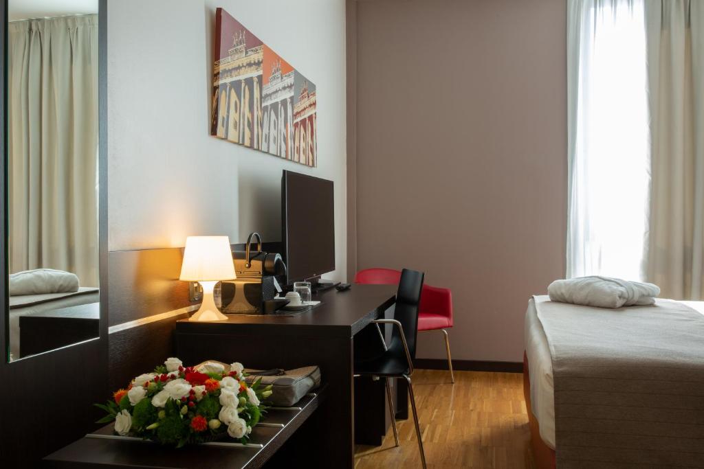 Postel nebo postele na pokoji v ubytování Euro Hotel Residence
