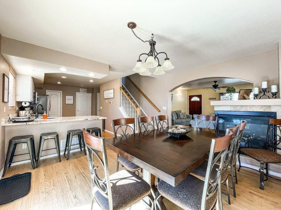 a dining room and kitchen with a table and chairs at The Mountain Lake Manor [Minutes from USAFA] in Monument