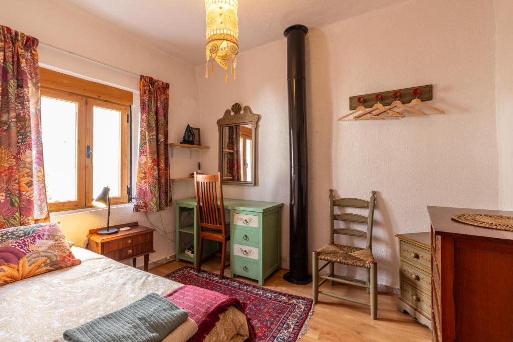 Łóżko lub łóżka w pokoju w obiekcie Casa El Sarük
