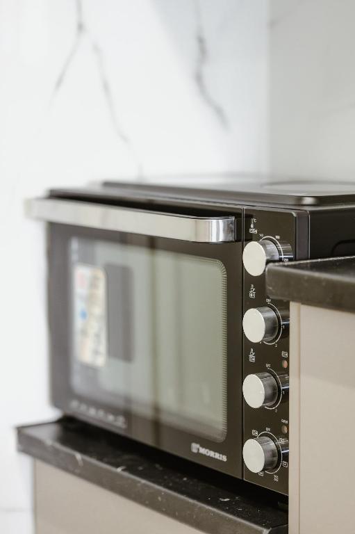 A kitchen or kitchenette at Central Apartments City Center