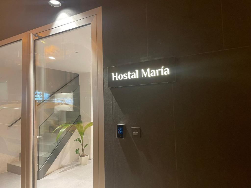 a hospital maratha sign on the side of a building at Hostal María in Elche