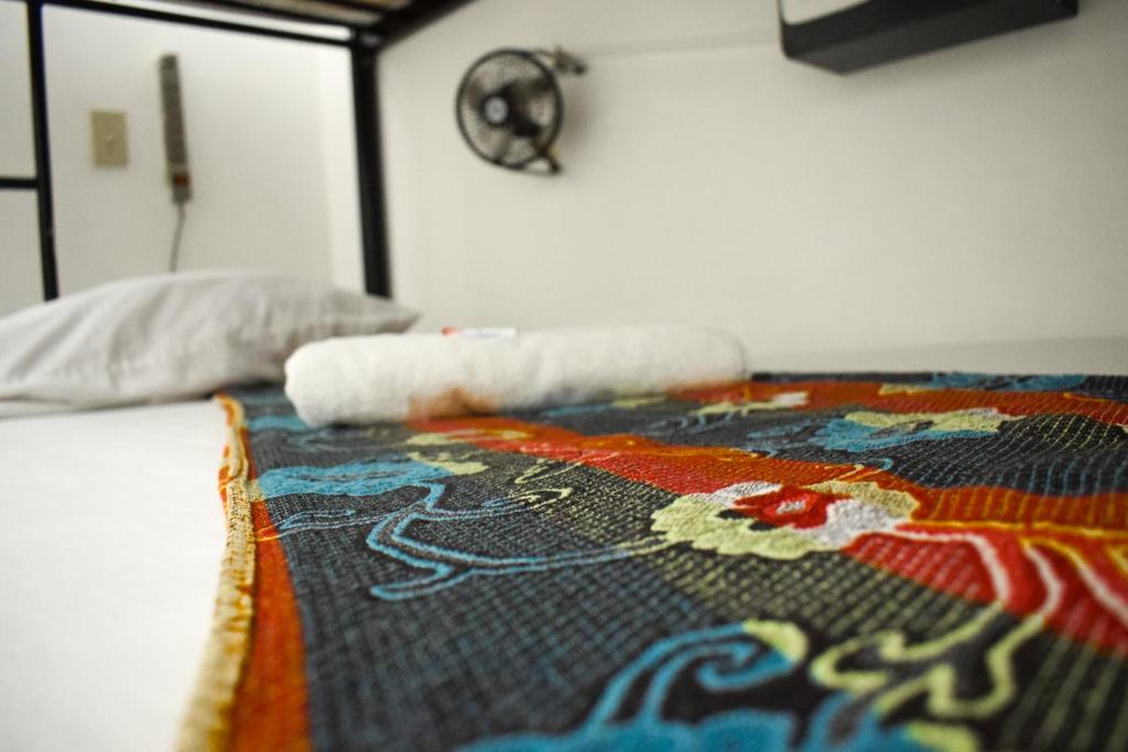 Letto o letti in una camera di Hostal Loco Coco Loco