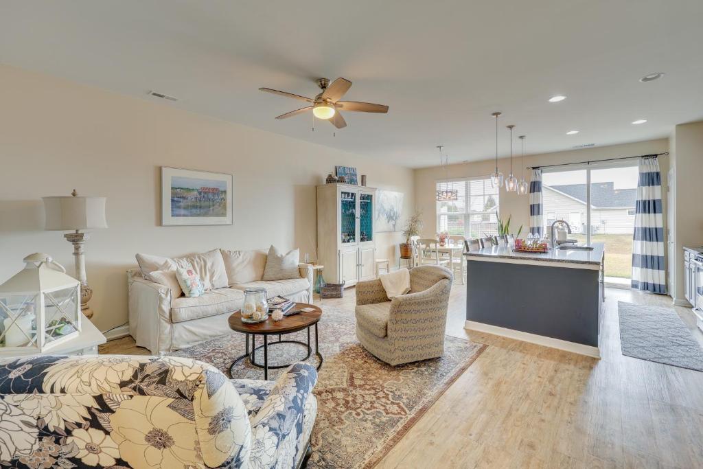a living room with a couch and a table at Sweet Dreamin Townhome about 7 Mi to Beach! in Wrightsville Beach