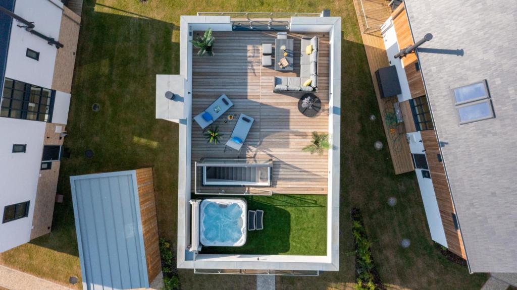 an overhead view of a house with a deck at Mallards Way ML01 HOT TUB Lakeside Spa in Somerford Keynes