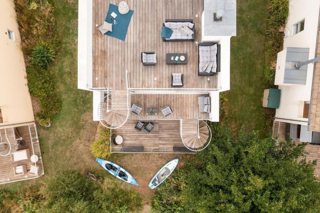 an overhead view of a house with boats on the yard at Calm Waters HM95 HOT TUB Lakeside Spa Property in Somerford Keynes