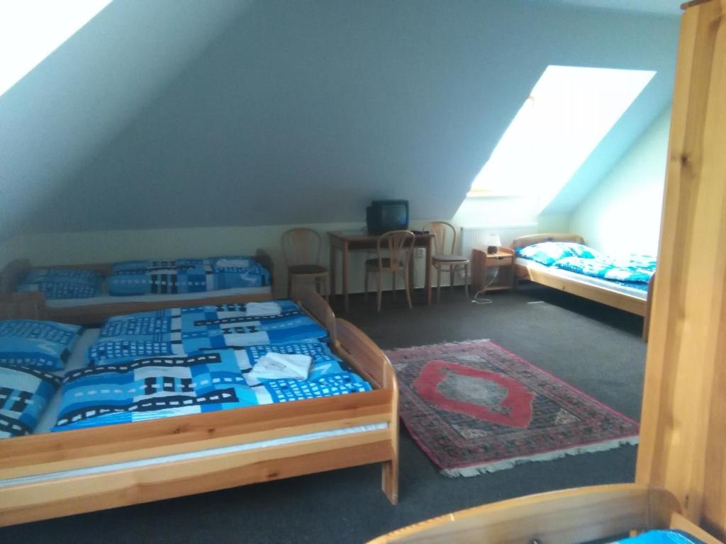 Postel nebo postele na pokoji v ubytování Hotel Nové Údolí