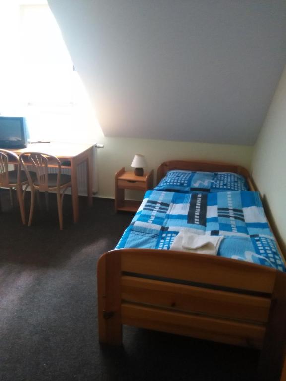 Postel nebo postele na pokoji v ubytování Hotel Nové Údolí
