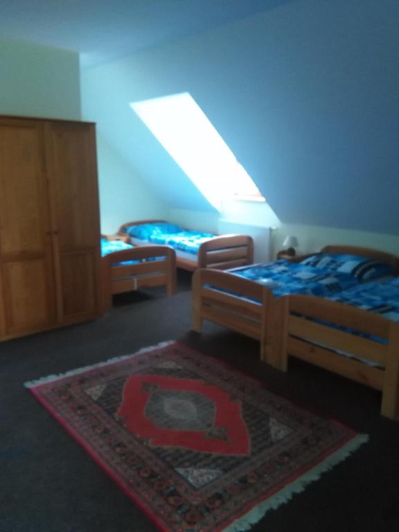 Postel nebo postele na pokoji v ubytování Hotel Nové Údolí
