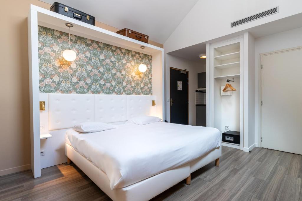 Postel nebo postele na pokoji v ubytování CALM Appart' & Hostel