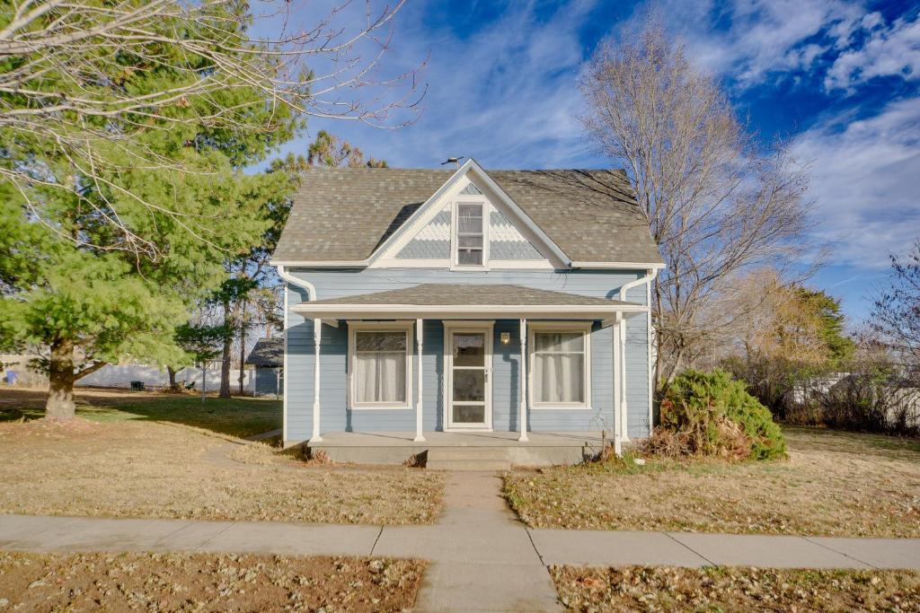 a white house with a driveway at Less Than 1 Mi to Vineyard Historic Farnam Home! in Farnam