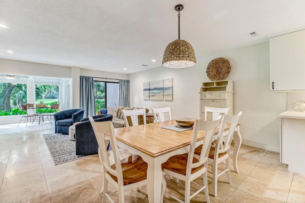 a kitchen and dining room with a table and chairs at 3325 Fairway Oaks in Amelia Island