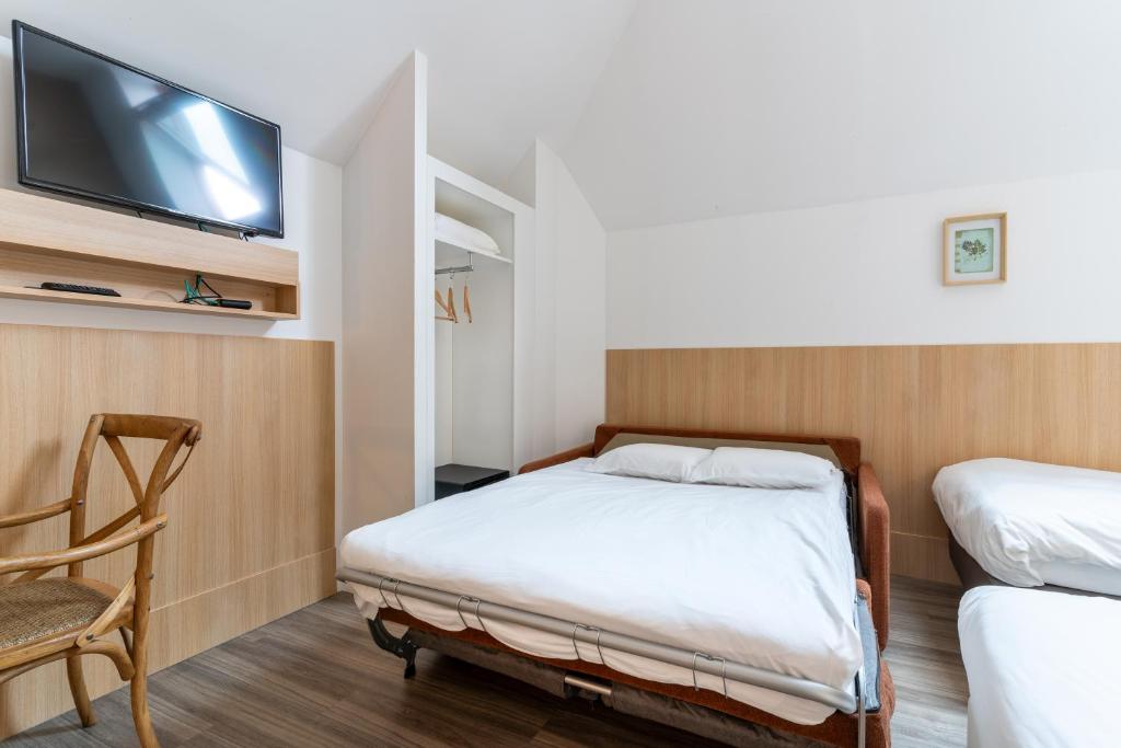 Postel nebo postele na pokoji v ubytování CALM Appart' & Hostel