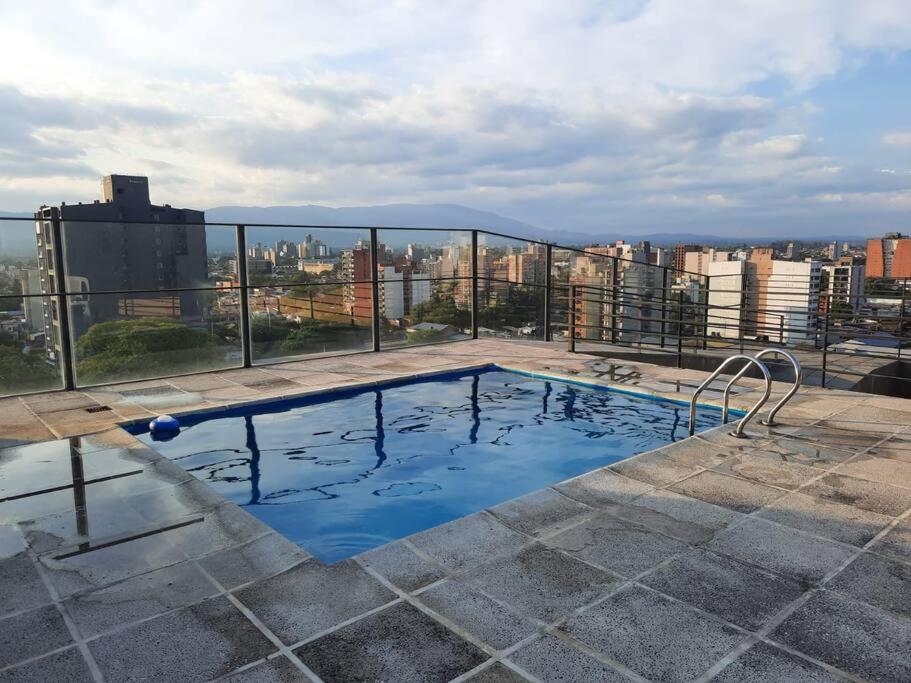 a swimming pool on the roof of a building at Loft Plaza Belgrano in San Miguel de Tucumán
