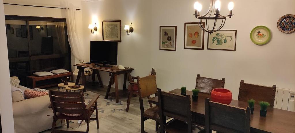 a living room with a table and chairs and a couch at Sintra/Colares Beach House with Mountain View in Sintra