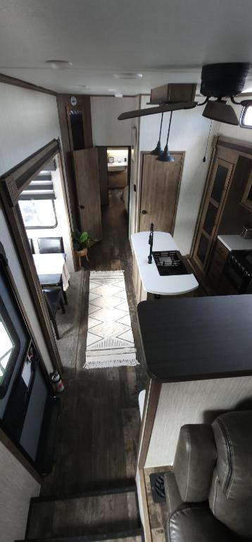 an aerial view of a living room and kitchen in an rv at So "Time to Wander" A pet friendly beach retreat in Fort Myers