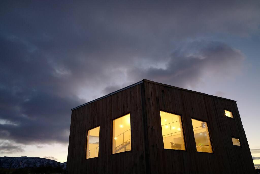 a building with windows on the side of it at Look Out - Loft in Puerto Natales