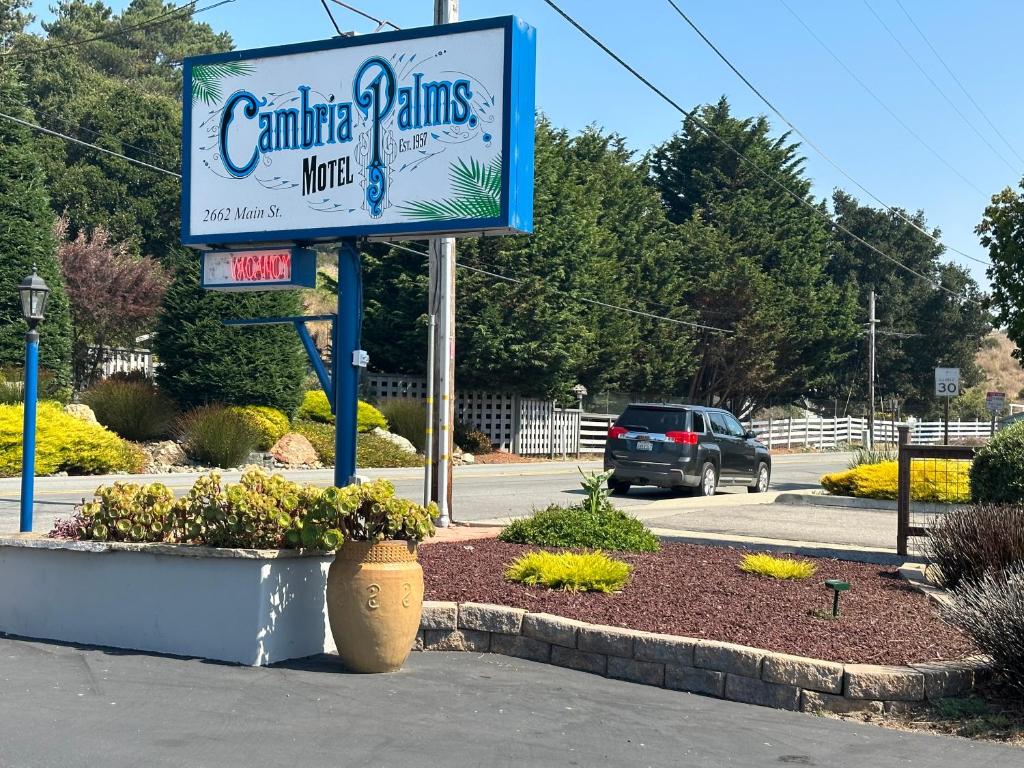 a sign for a carribeanolisolisolisolisolisolisolisolisolis at Cambria Palms Motel in Cambria