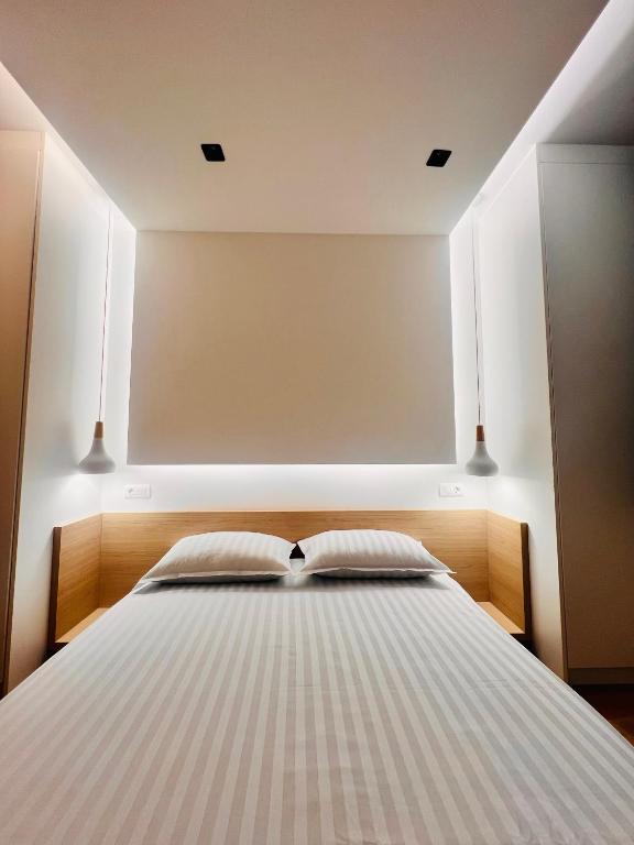 Postel nebo postele na pokoji v ubytování Apartment 202 - Aparthotel Zlatni Javor