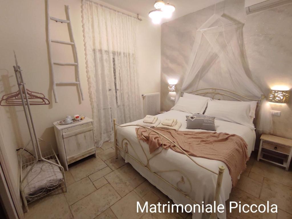 Postel nebo postele na pokoji v ubytování Lo splendore dei Sassi