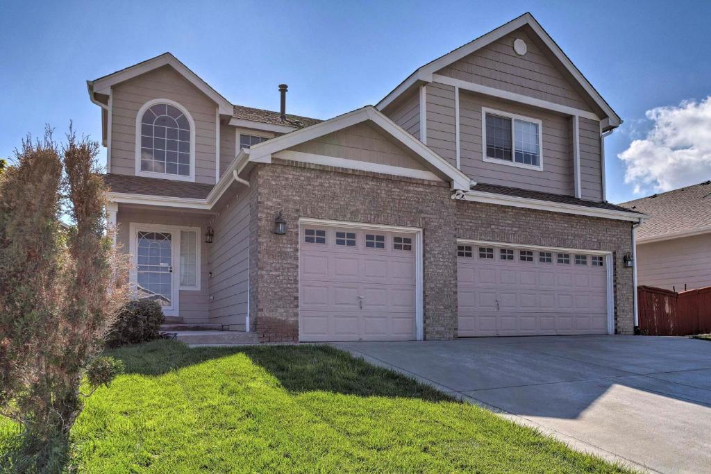 a large house with a garage at Spacious Parkview Home Near Denver with Game Room in Thornton