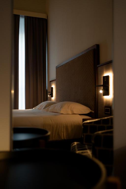 Postel nebo postele na pokoji v ubytování Lo Stemma Luxury Boutique Hotel