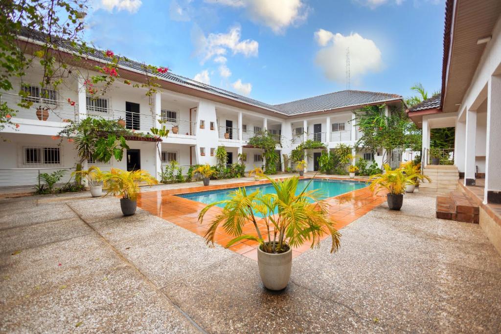 a courtyard of a house with a swimming pool at Luxurious Estate in Sekondi-Takoradi