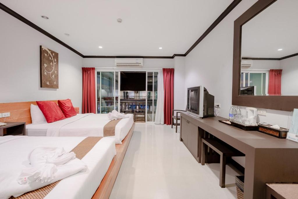Postel nebo postele na pokoji v ubytování Napalai Resort Hua Hin