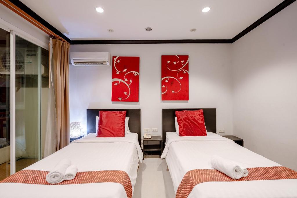 Postel nebo postele na pokoji v ubytování Napalai Resort Hua Hin