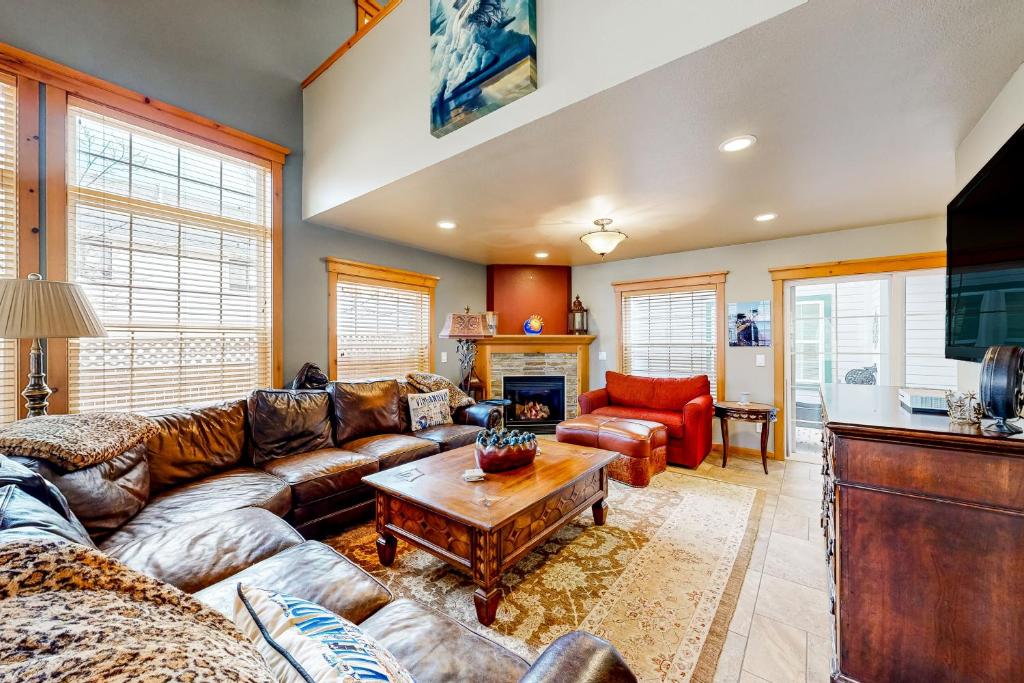 a living room with a couch and a table at Flagstaff Fantasy - Entire Property in Flagstaff