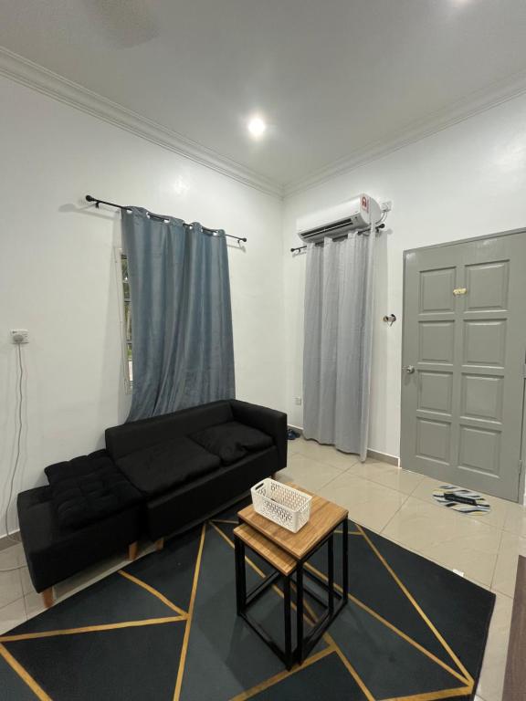 Manong Kuala Kangsar Homestay Chegu Wok tesisinde bir oturma alanı