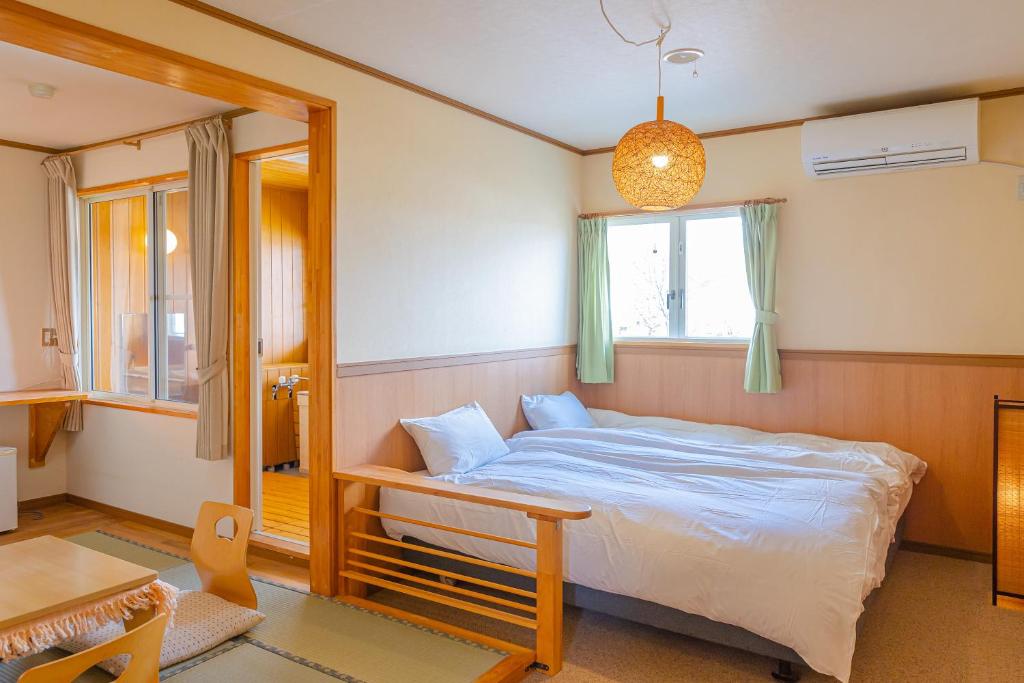 Postel nebo postele na pokoji v ubytování Funny Inn
