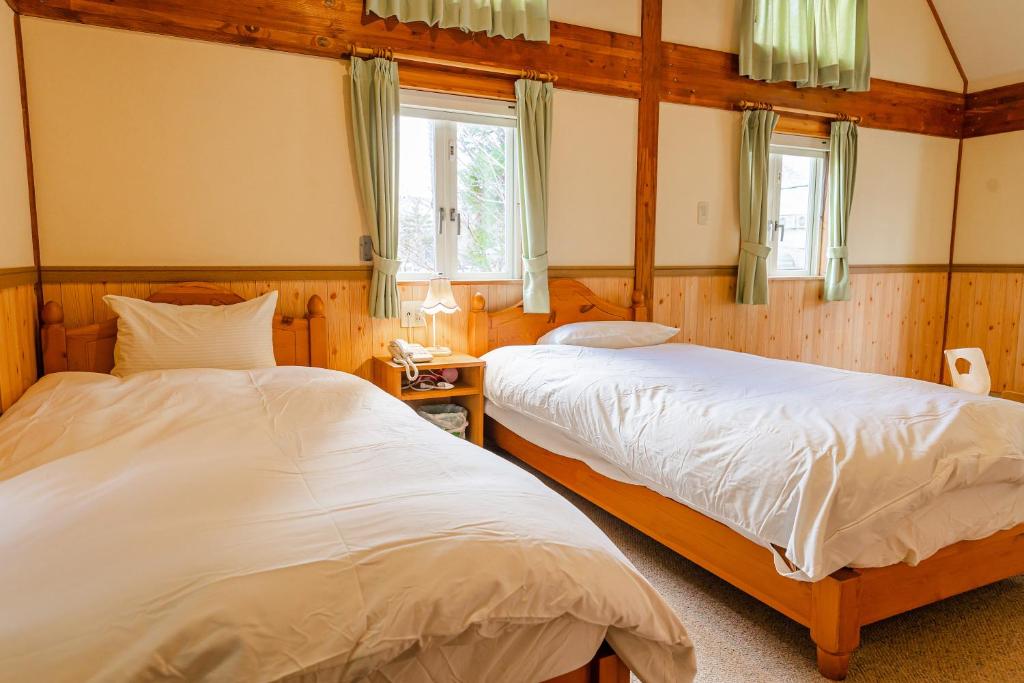 Postel nebo postele na pokoji v ubytování Funny Inn
