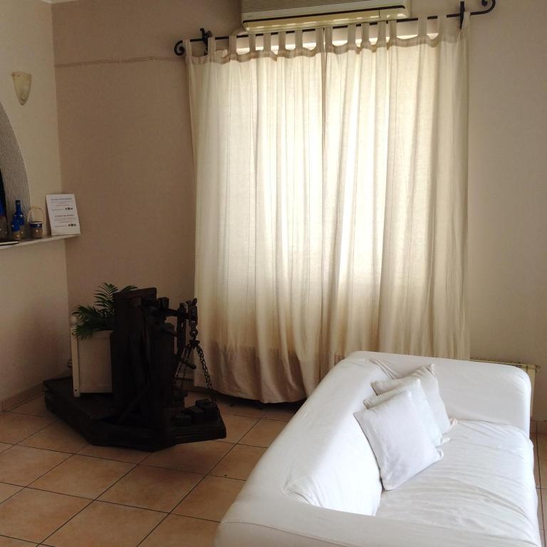 Postel nebo postele na pokoji v ubytování Rozos Hotel