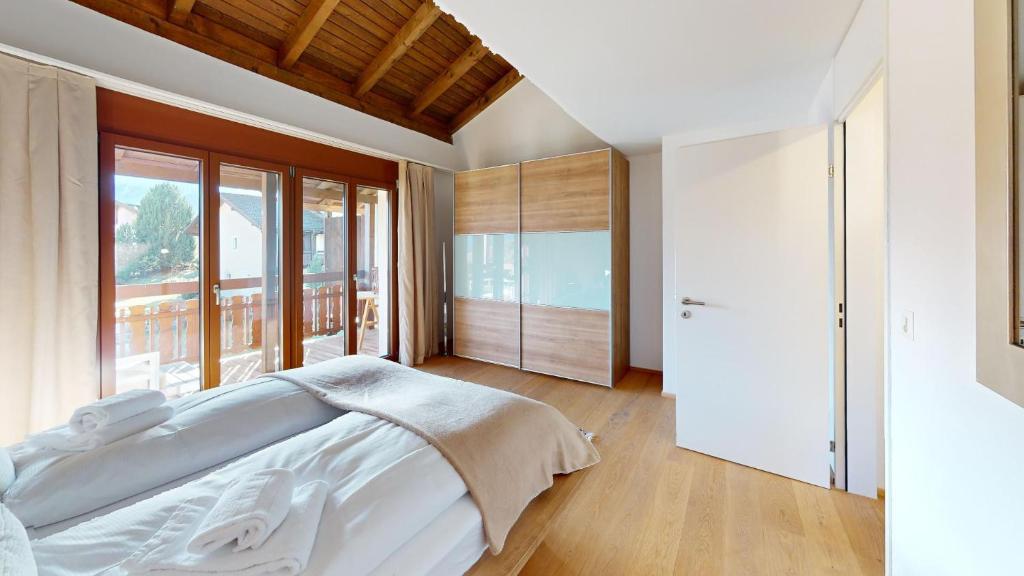 Postel nebo postele na pokoji v ubytování Family holiday home Tgiampi Sot Lantsch Lenzerheide