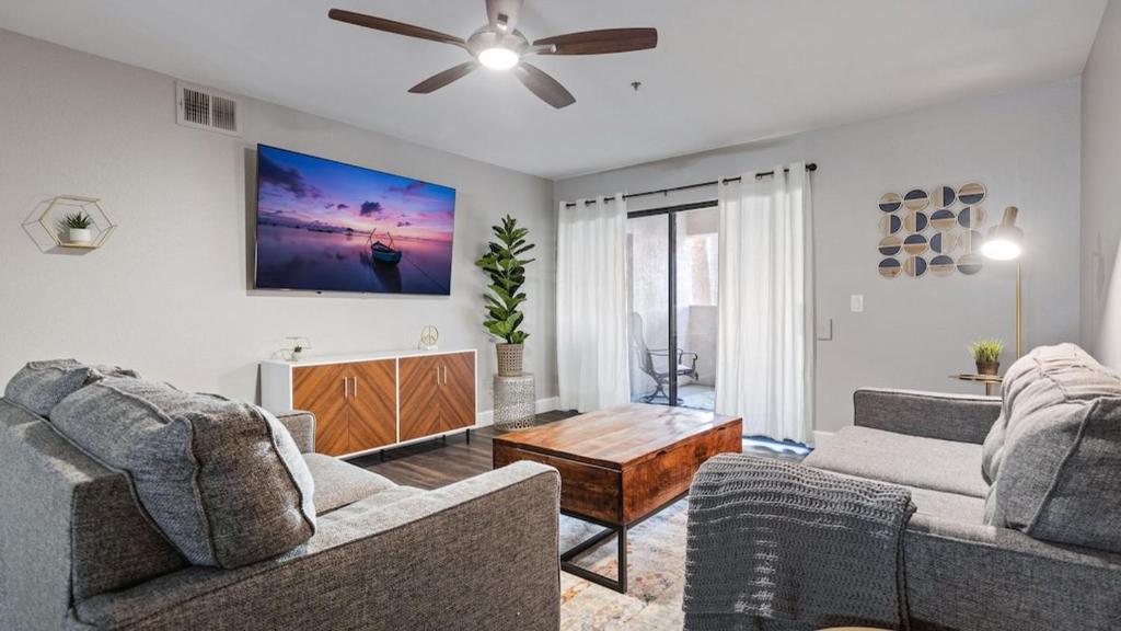 a living room with two couches and a ceiling fan at Beautiful newly remodeled 2-Bdrm Biltmore Condo in Phoenix