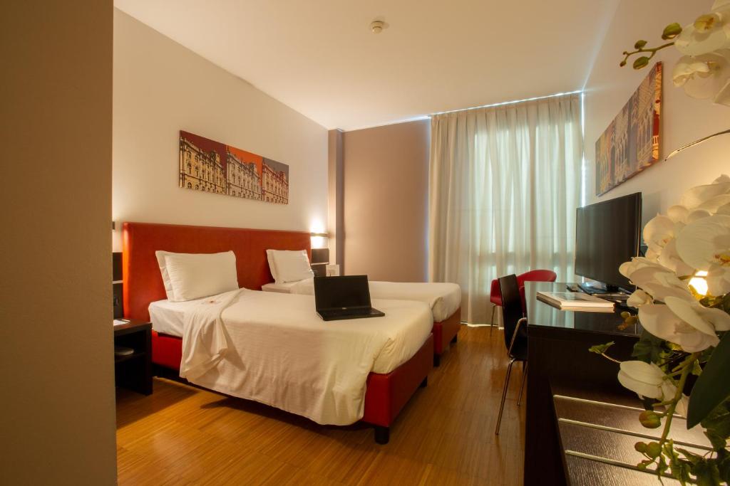 Postel nebo postele na pokoji v ubytování Euro Hotel Residence