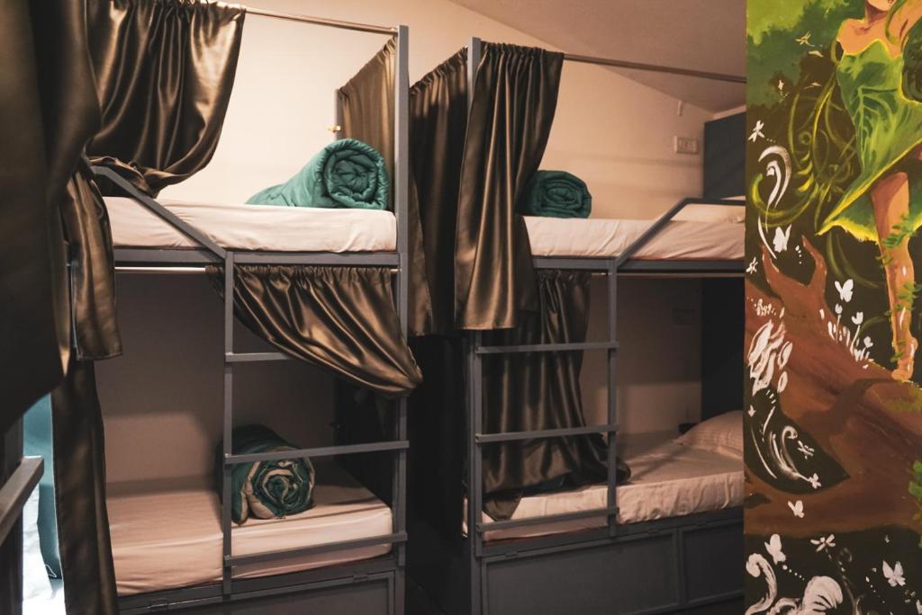 a group of bunk beds in a dorm room at 12 Monks Hostel in Arambol