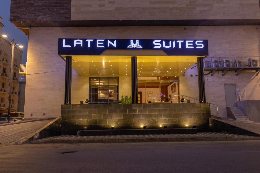 a store with a sign that reads lier n suites at Laten Suites Al Salim Plaza in Jeddah