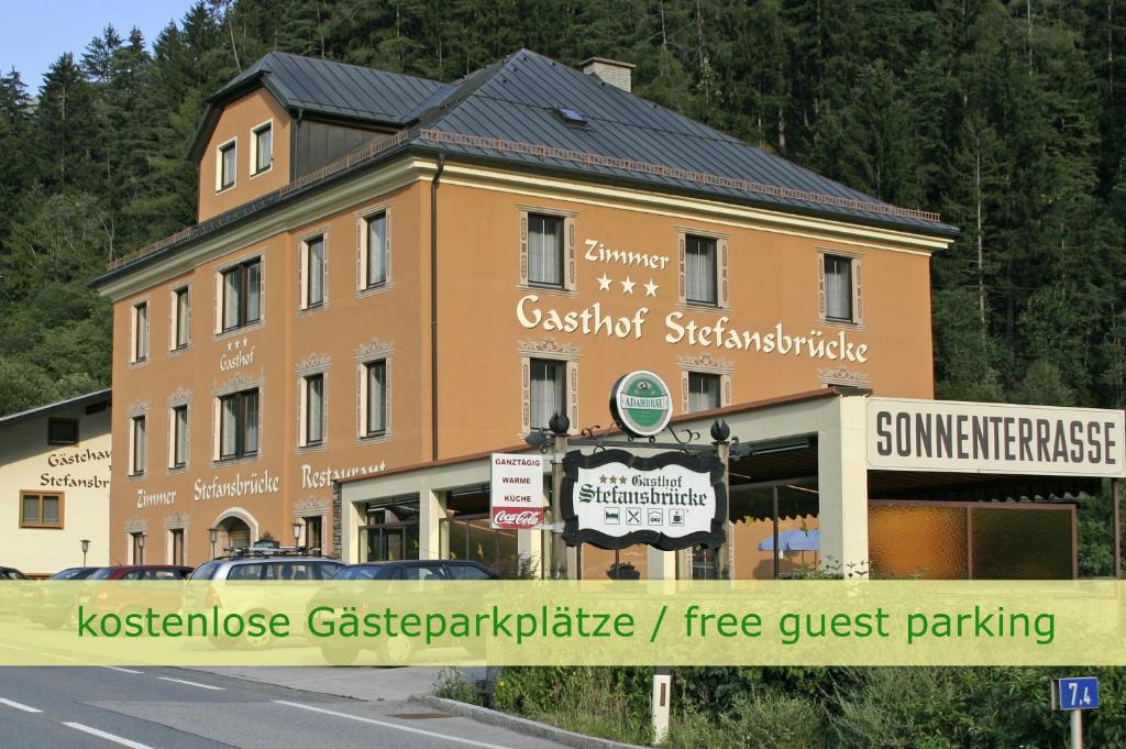a building with a sign in front of it at Hotel Gasthof Stefansbrücke in Innsbruck