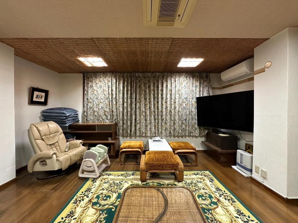 a living room filled with furniture and a flat screen tv at Marina and Numazu sweet 1F - Vacation STAY 16710v in Numazu
