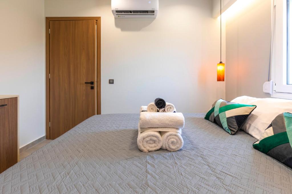 Postel nebo postele na pokoji v ubytování Tertsa Suites