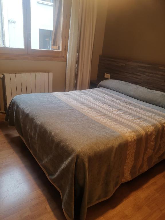 Postel nebo postele na pokoji v ubytování Apartamentos Casa Roldan