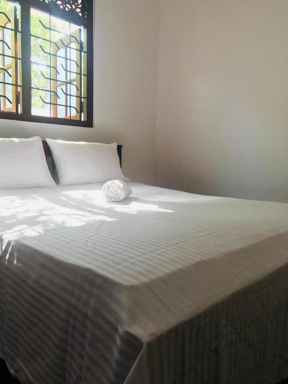 Postel nebo postele na pokoji v ubytování Lora Homestay