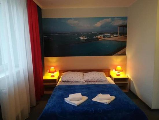 Łóżko lub łóżka w pokoju w obiekcie Hotel Czarna Perła