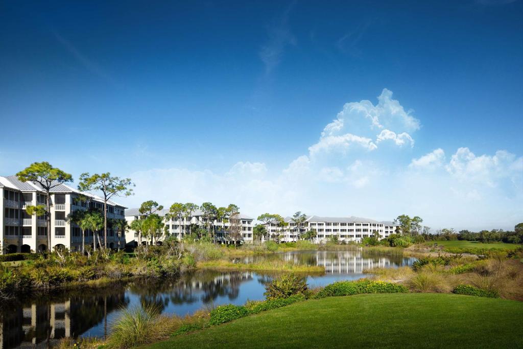 a rendering of a resort with a pond at Hyatt Vacation Club at Coconut Cove in Estero