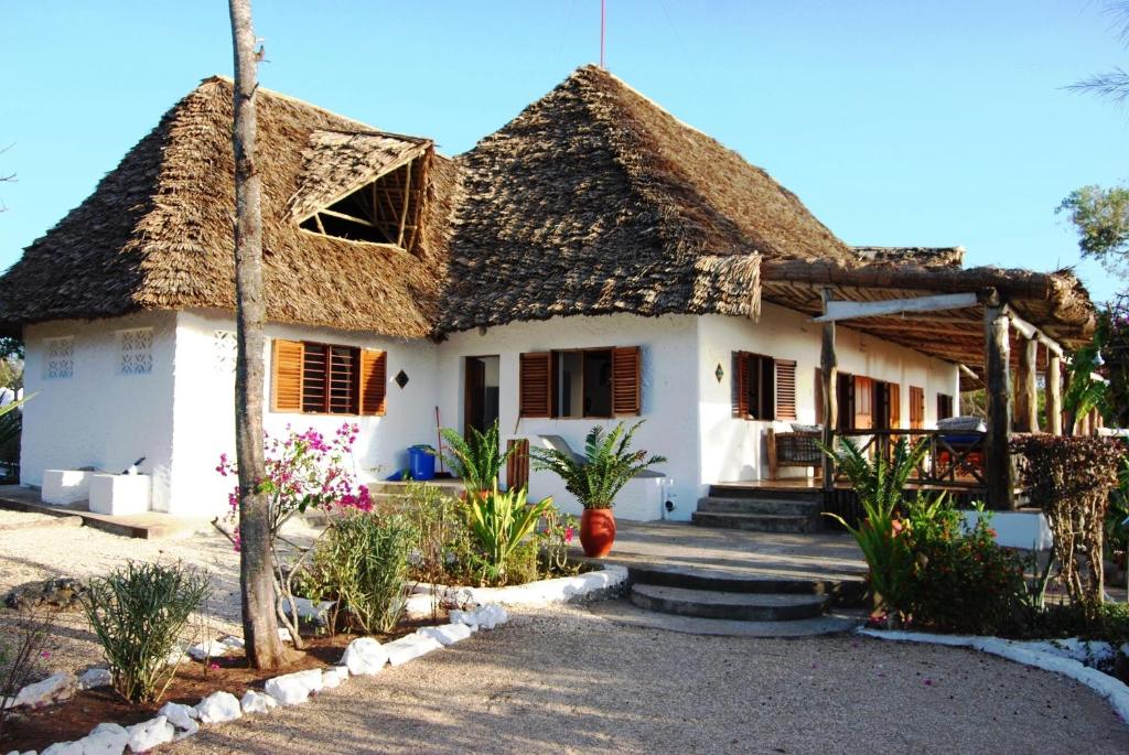 a house with a thatched roof at Fully Private 390sqm VILLA 3stars NO SHARING serviced Matemwe beach in Gazija