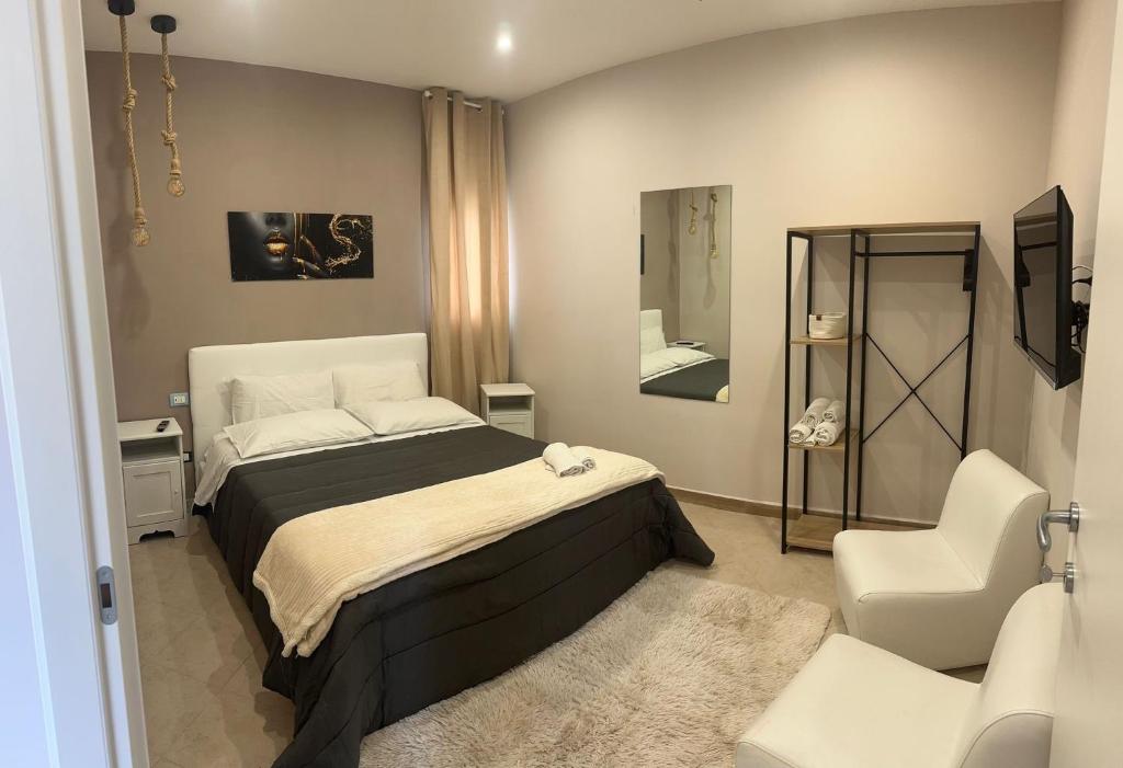 Ένα ή περισσότερα κρεβάτια σε δωμάτιο στο Casa Auri