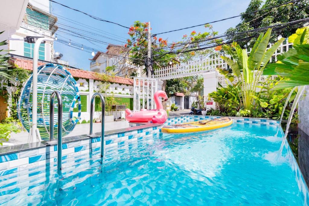 a pool with two inflatables in a house at Villa Hồ Bơi HOÀNG ĐỨC Trung Tâm BÃI SAU in Vung Tau