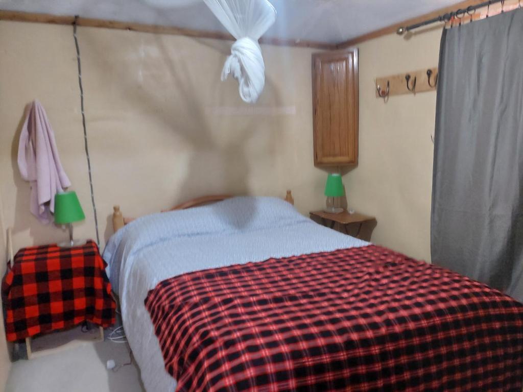 Postel nebo postele na pokoji v ubytování KANUNKA HOUSE