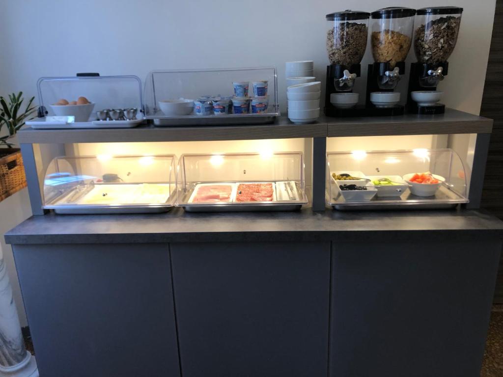 Kuchyň nebo kuchyňský kout v ubytování Hotel Cairoli